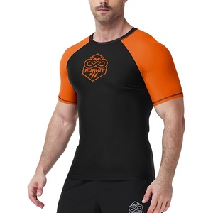 image:imageRunhit Mens BJJ Rash Guard Jiu Jitsu Compression Shirts Short Sleeve for MMA No GI Wrestling Sports Base Layer UPF 50Orange